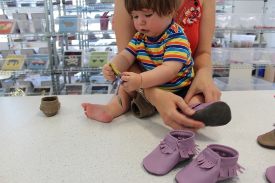 Trying on Mally Mocs baby moccasins 